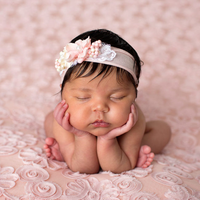 newborn photographer vacaville baby girl posed on pink