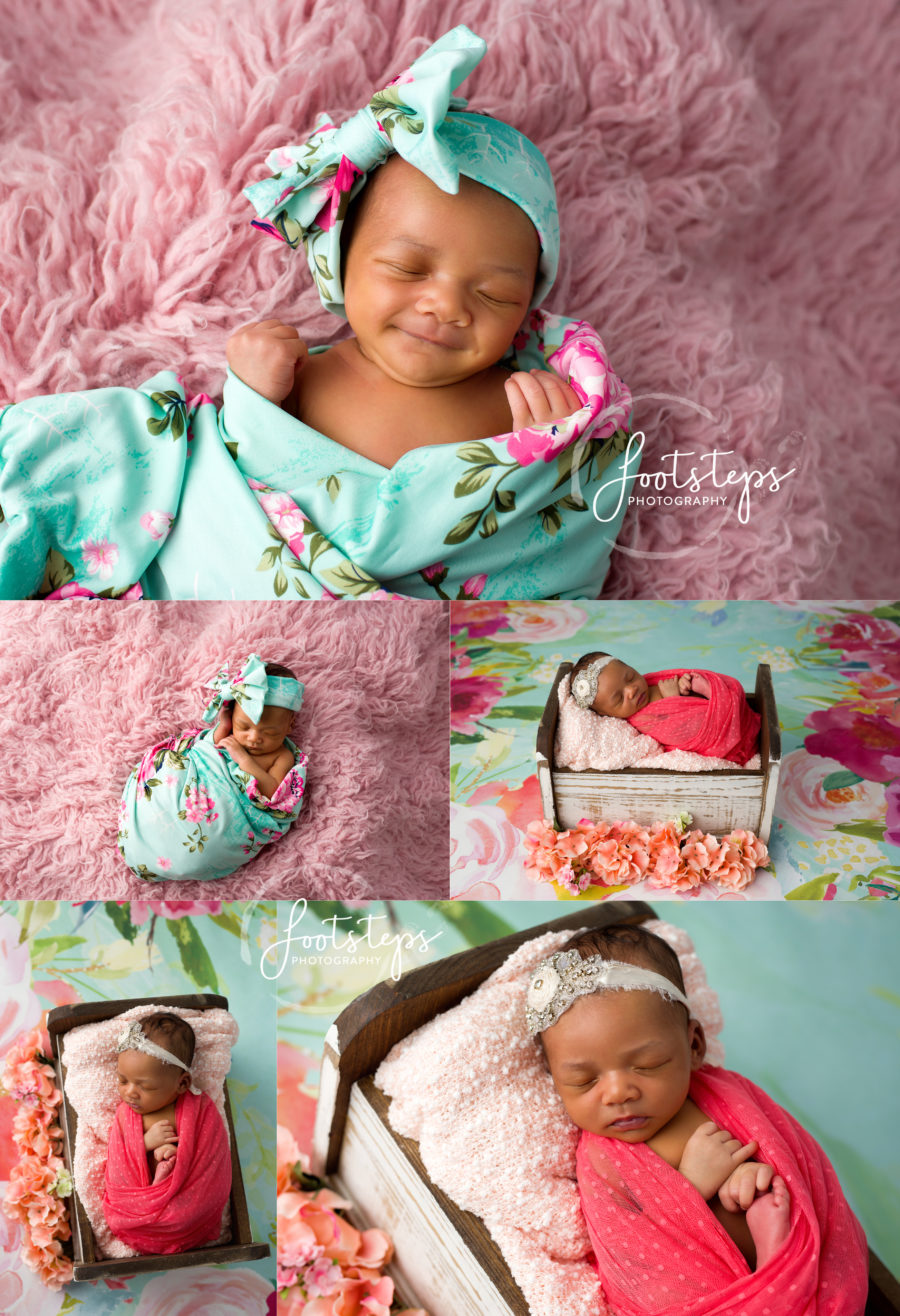 smiling newborn baby in floral wrap