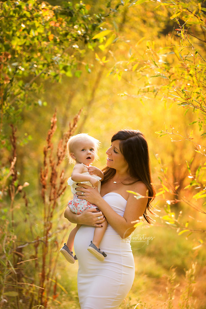 Mother and daughter posing for footsteps photography